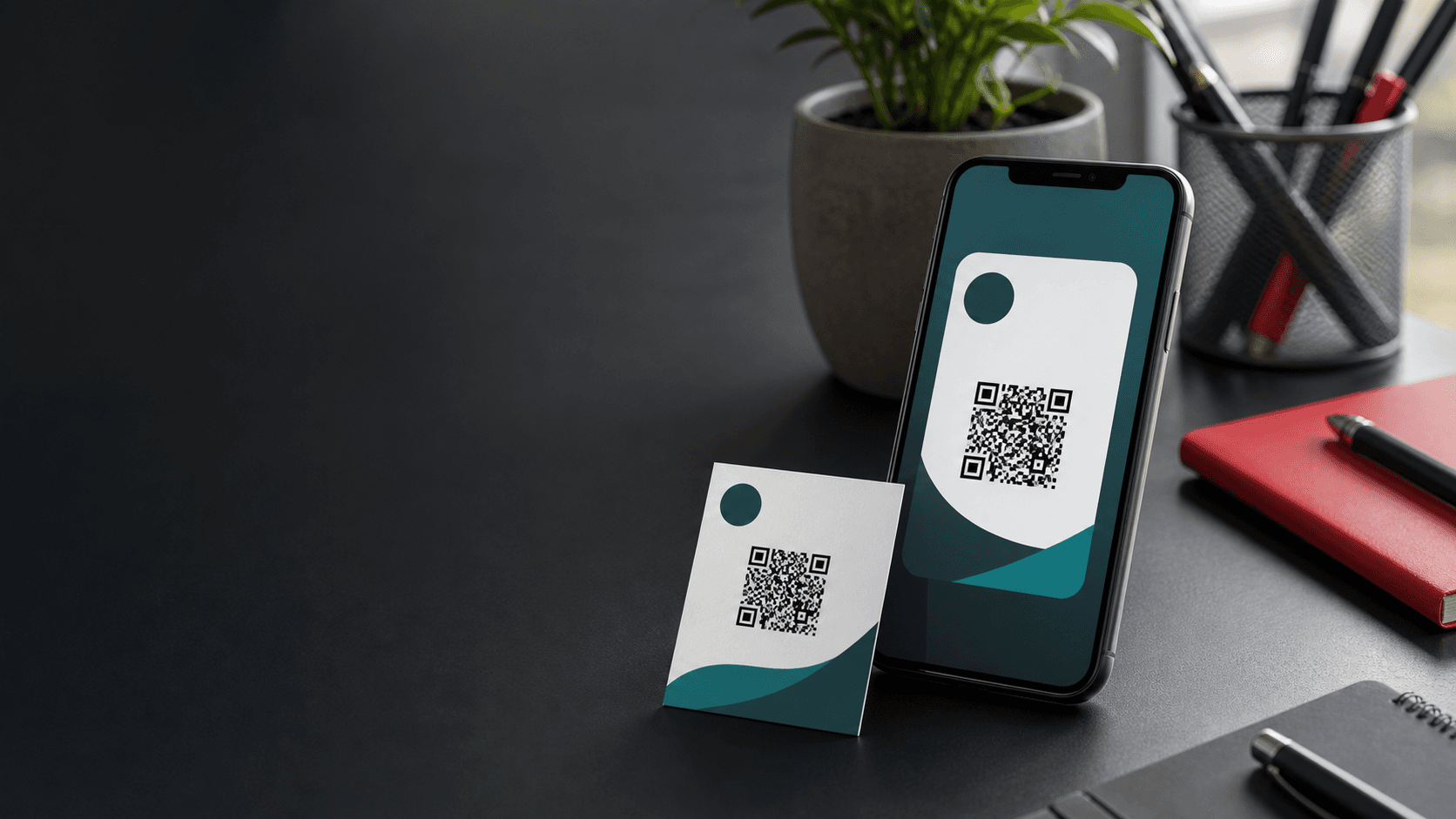 Phone and printed business card with QR codes on a desk